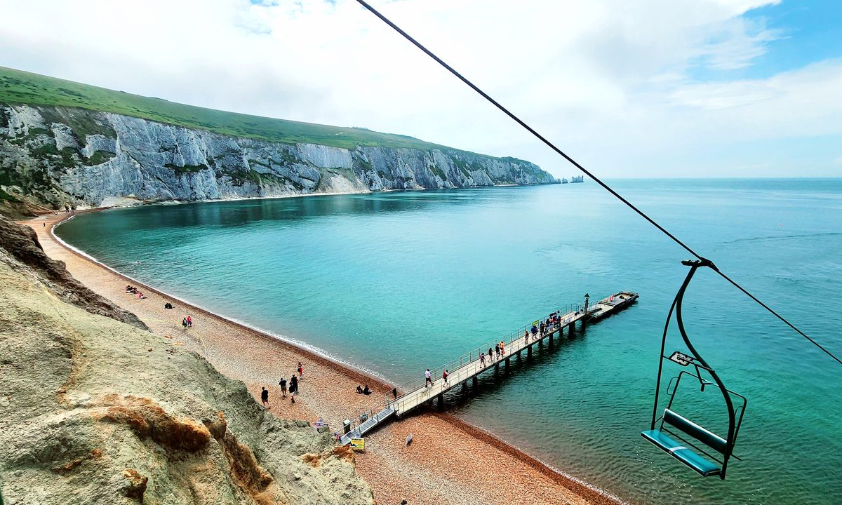 A chairlift running down to the beach and pier at Alum Bay