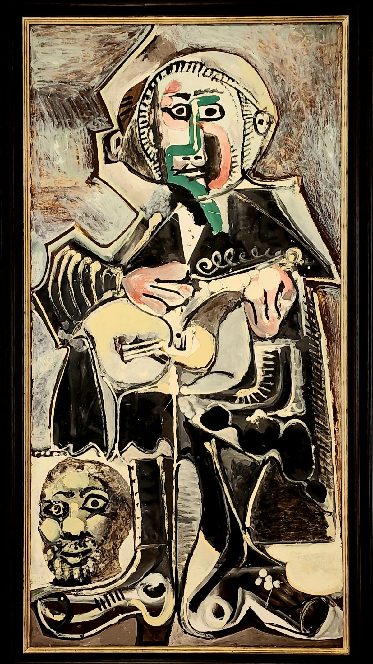 A colorful cubist painting of a seated figure in a museum