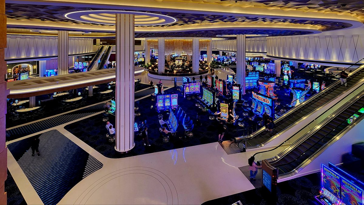 Looking over a busy casino floor from an upper balcony
