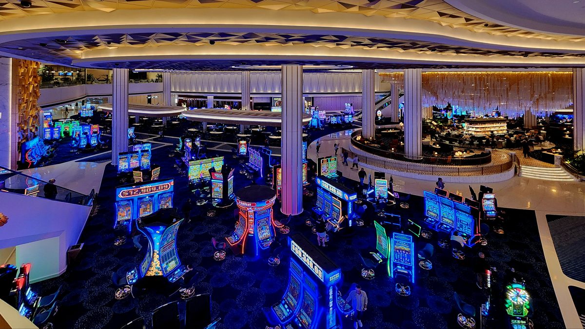 A Las Vegas casino floor glowing with blue lights and slot machines