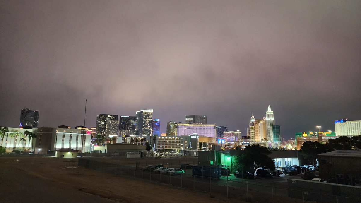 The Las Vegas skyline glowing under low clouds at night