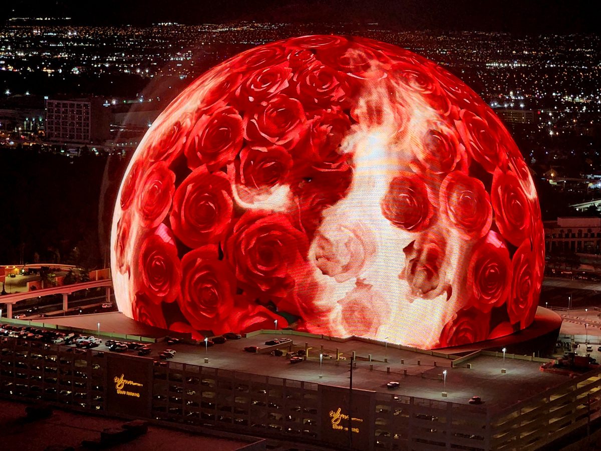 The Las Vegas Sphere lit up as a glowing red planet at night