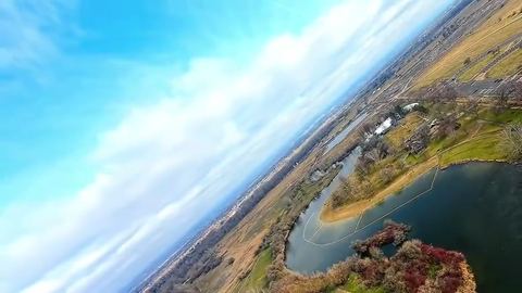 Drone banks over a pond and park in Eagle, Idaho